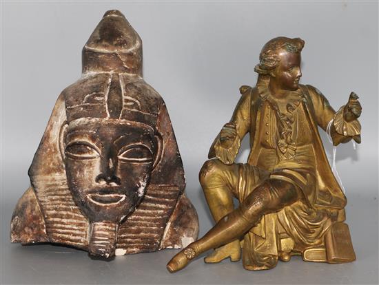 Gilt metal figure and an Egyptian carving